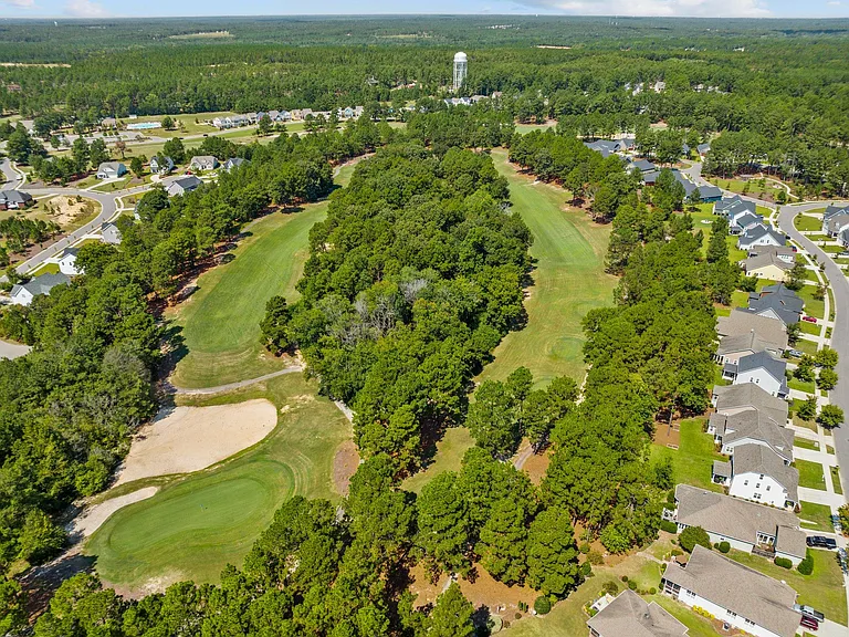 The house backs on to the 7th fairway (right hand side)