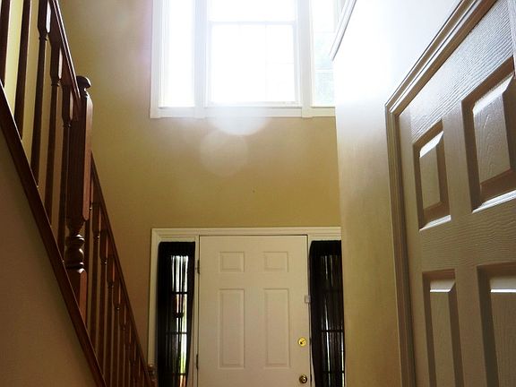 Entry, powder room door to the right