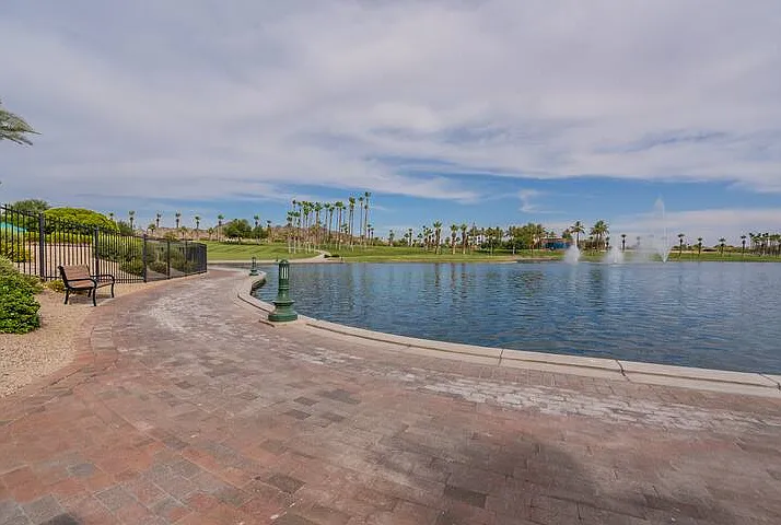 A view of North Lake with the fountains and walking trail around the lake. Enjoy a quiet evening stroll watching the sunset over the lake.