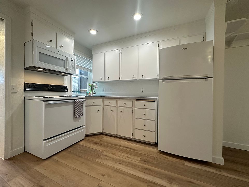 Bright kitchen with full-size appliances and double sink. Window for fresh air and light!