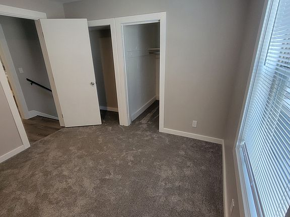 Large closet with new carpet and fresh paint