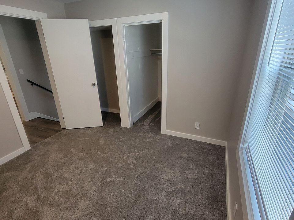 Large closet with new carpet and fresh paint