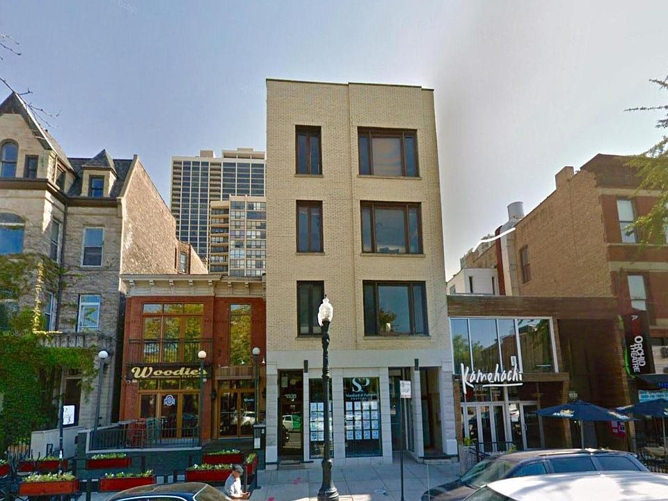 Street view! The coach house sits aside a secluded courtyard out back. The first floor of the front building is now a Pilates studio, and Buzz Bait is now Bambo Bar!