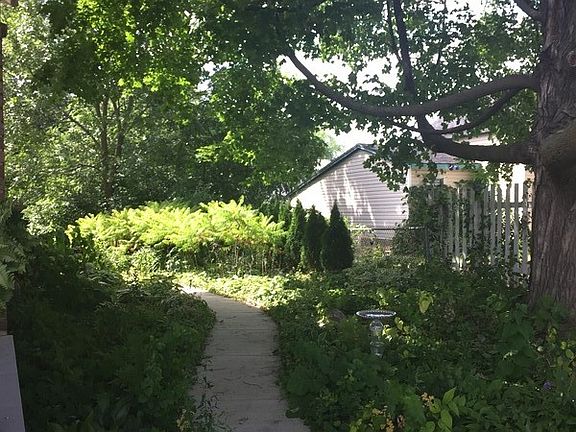 Side yard
						:
						new sidewalk and perennials