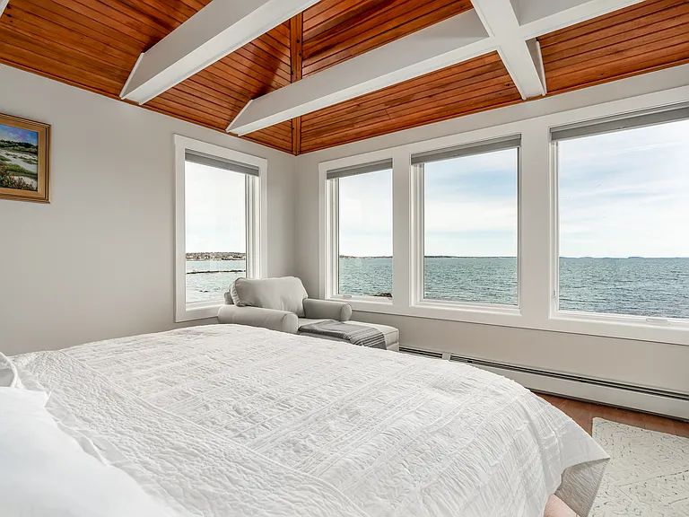 The third floor master bedroom with a king bed. Panoramic ocean views.
