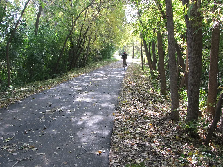 Blacktop trail borders property!