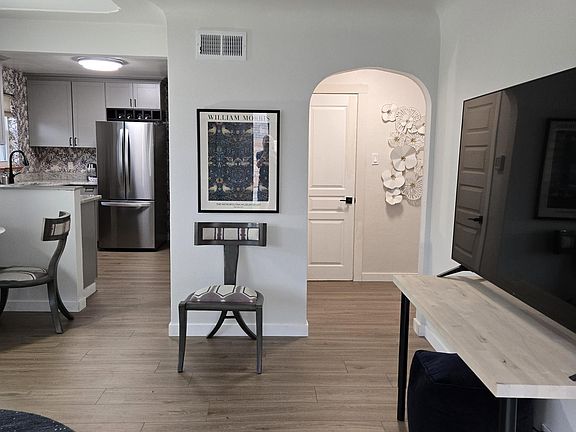 Hallway leads to the two bedrooms and bath and utilities' closet for the central air conditioning, gas heater and gas water heater.