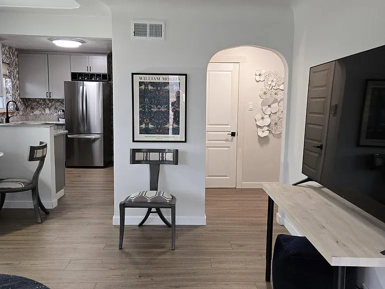 Hallway leads to the two bedrooms and bath and utilities' closet for the central air conditioning, gas heater and gas water heater.