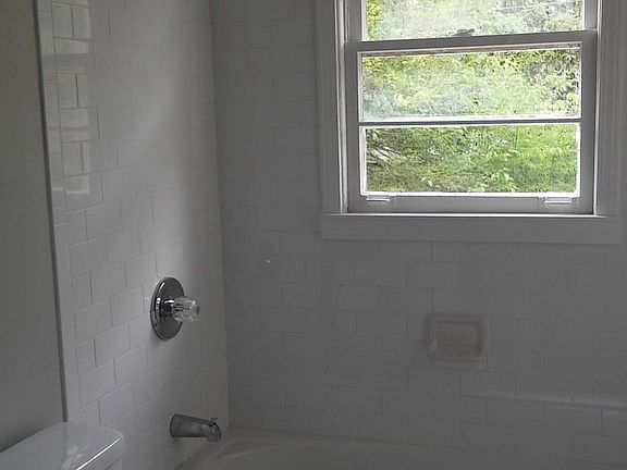 Clean subway white tile bath