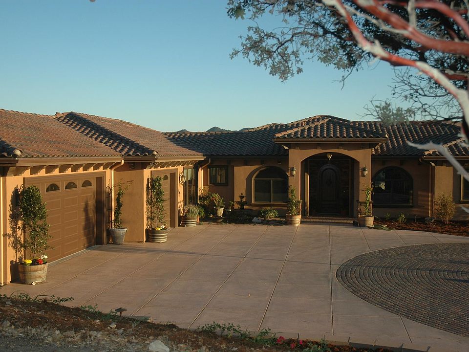Front Entrance and 3 car garage.