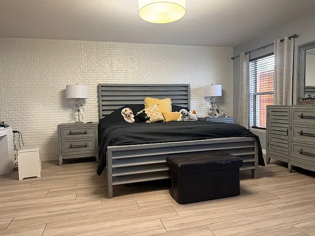 Spacious primary bedroom with modern finishes and plenty of natural light