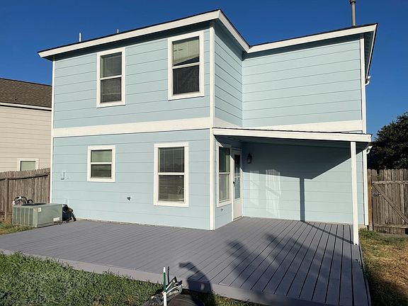 Back of the house with a nice patio and spacious backyard