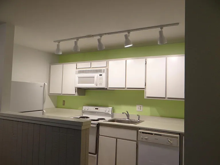 Kitchen with generous cabinets and full size refrigerator