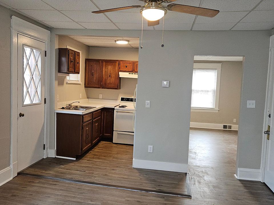 View of the kitchen and bedroom from the living room.
