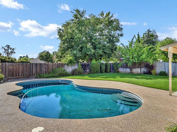 Grand and glorious pool! Perfect for swimming laps in. Great grass area and covered patio. Awesome for entertaining!