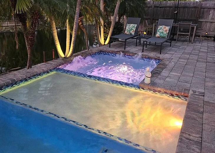 Elegant Landscape Lighting & Solar Tiki Torches Activate at Dusk