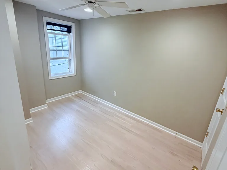 Spacious bedroom 2 with built in shelves