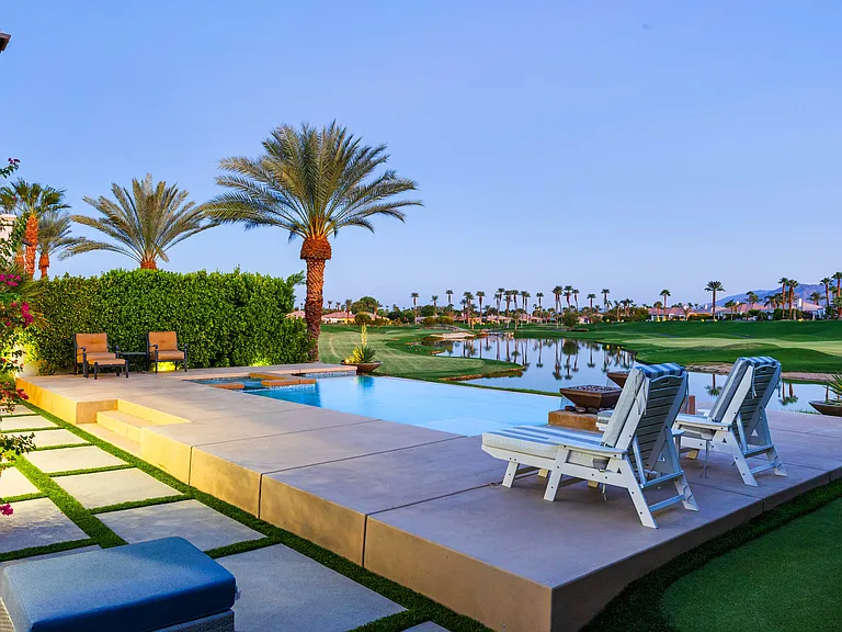 Elevated on a private angle with unobstructed views of the golf course and surrounding mountains, this fully furnished 4-bedroom, 3.5-bath residence blends luxury with seclusion.