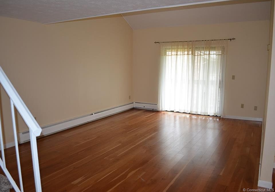 Large living room with sliders to balcony