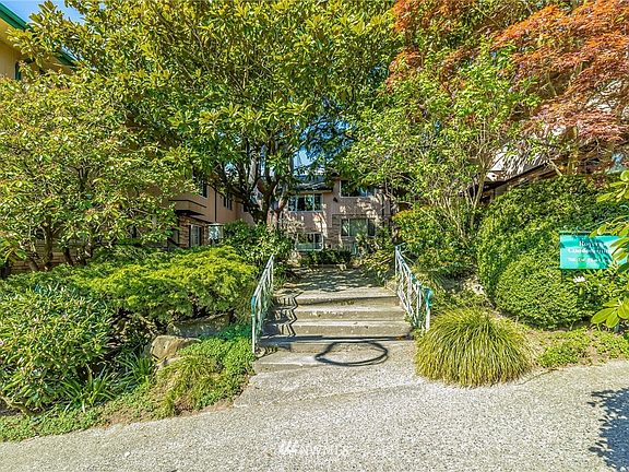 View from Street into Courtyard.  HOA Dues Include Water, Sewer, Garbage, Heat & Hot Water!