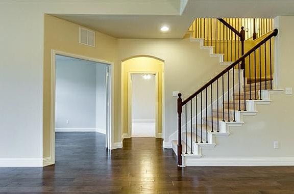 Beautiful wood floors, upgraded base boards and wrought iron spindles