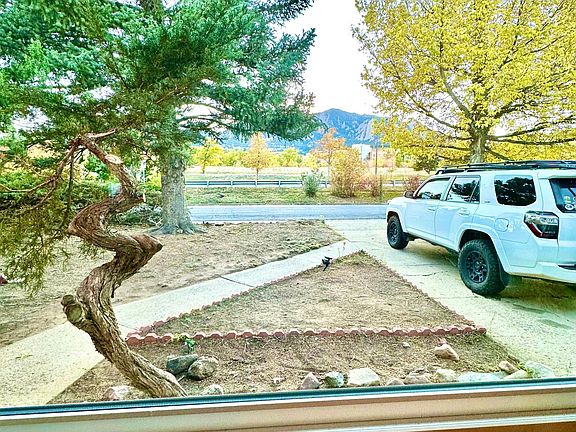 This is the view of the Flatirons from the living room's big window. We will be doing some yard design and making the front look nicer the weekend of October 29-30.