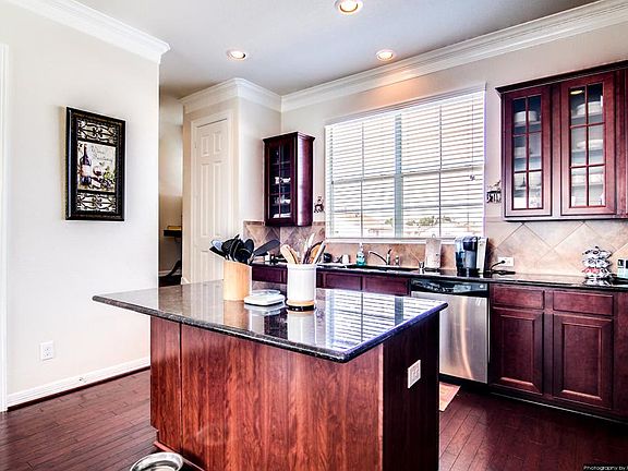 Kitchen island with overhang for grabbing a quick bite to eat.