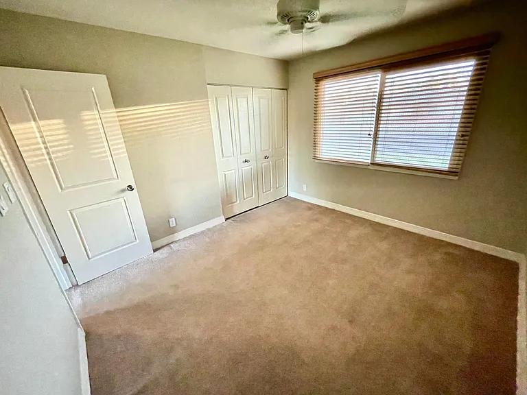 bedroom three with ceiling fan