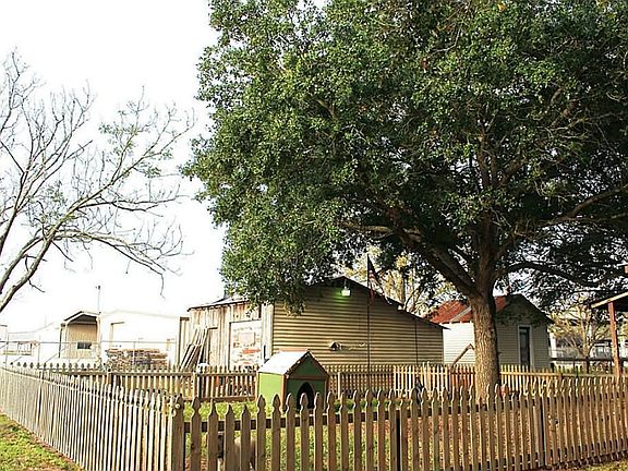The backyard is fenced which makes it ideal for those with pets or small children and is complete with mature trees that shade the area.