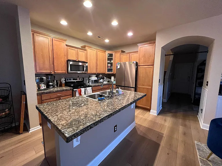 Kitchen with granite countertops and cherry cabinets