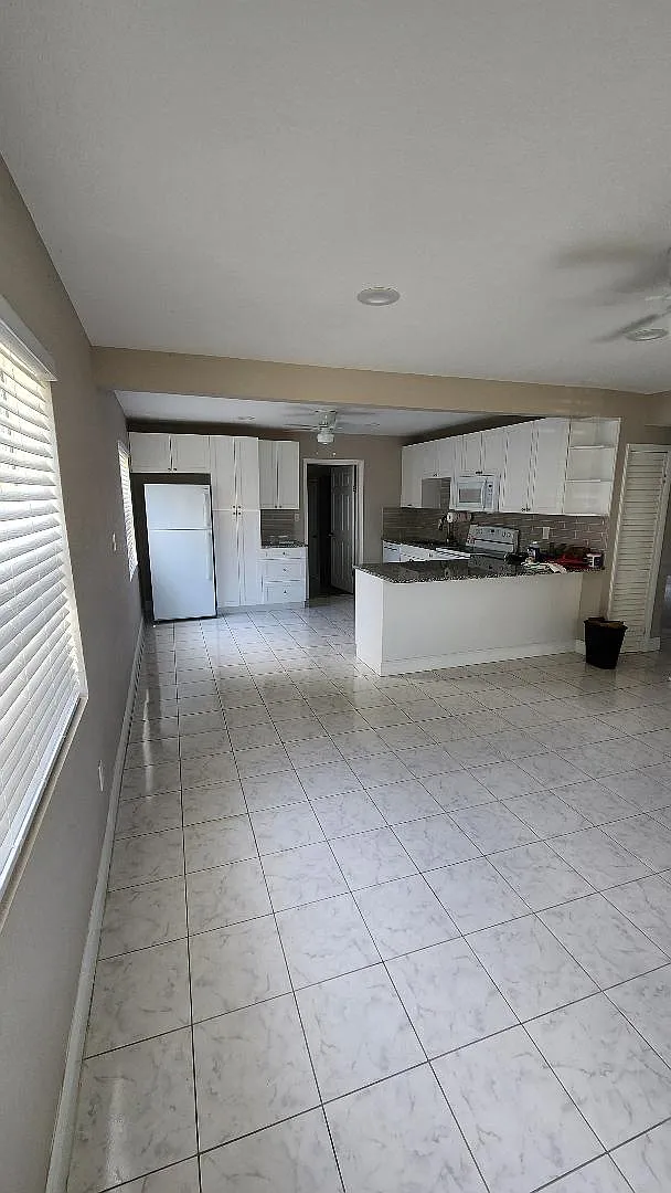 Living room looking into the kitchen, open floor plan - 4945 36th Ave N