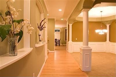 As you enter, the formal dining and living room greet you on your right.