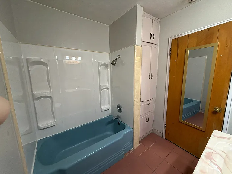 Master bathroom with brand new tub surround.