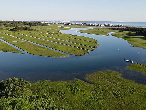 Aerial of creek, marsh, bay