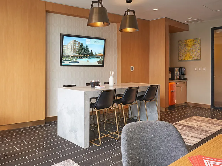 The clubroom offers cool and classic decor, a vintage inspired chef's kitchen, and direct access to the patio for relaxing and entertaining.