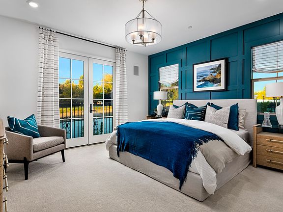 An image of the primary bedroom in the Plan 3 Model Home at Villas at Los Coyotes Country Club.