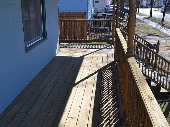 Good sized covered porch perfect for some cozy furniture and a book, even on a rainy day.