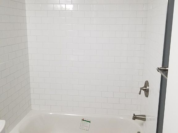 new subway tile shower/tub; all brushed nickel finishes