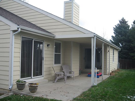 back door to kitchen eating area and far sliding doors to master