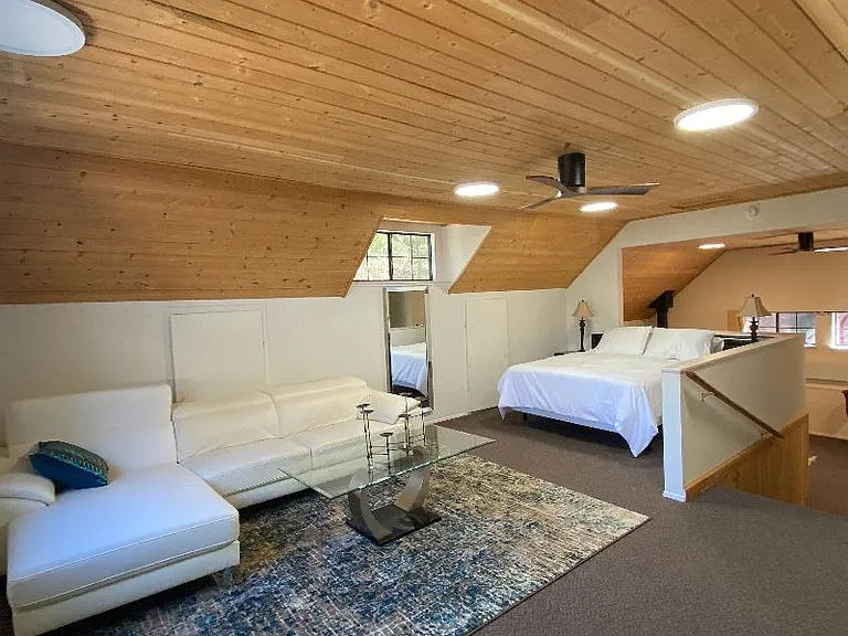 Loft with sleeping area.
