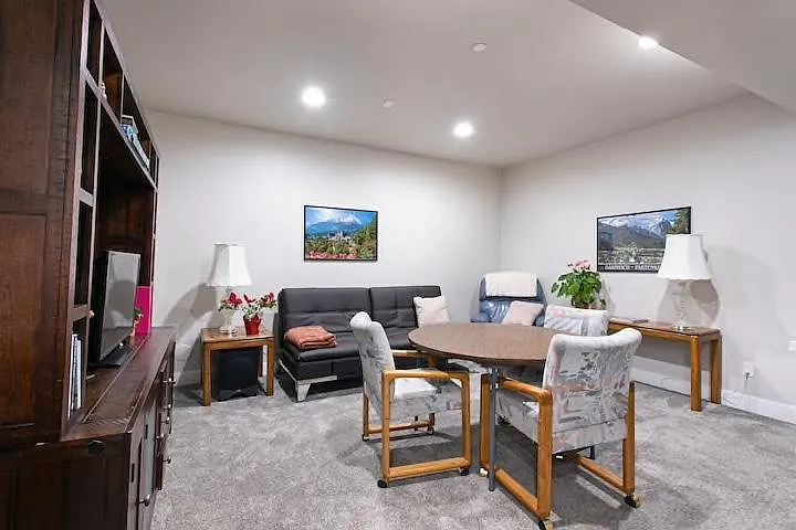 Downstairs living room/media room with wet bar