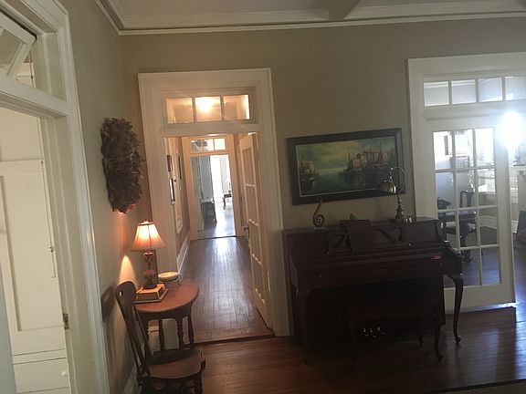 Den in front 
Wide hallway