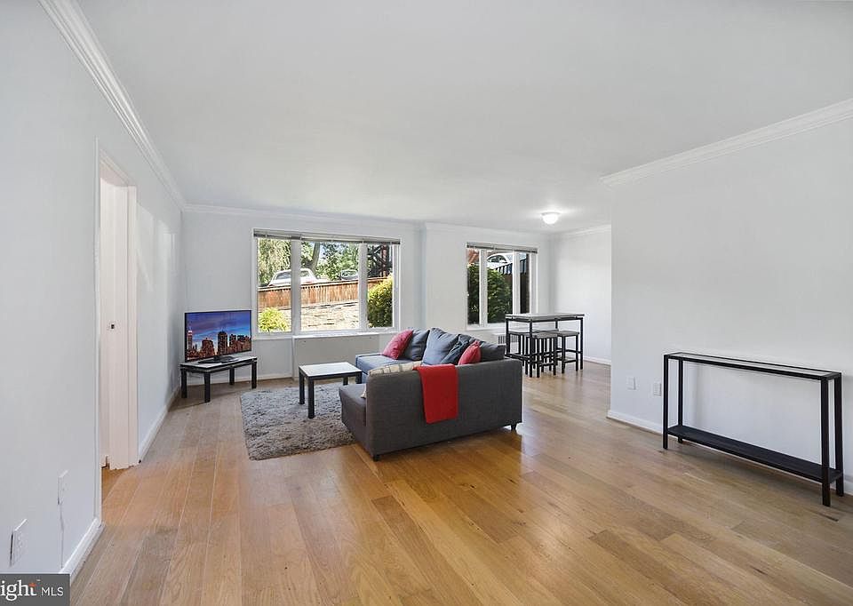 Entryway with wide plank wood floors.