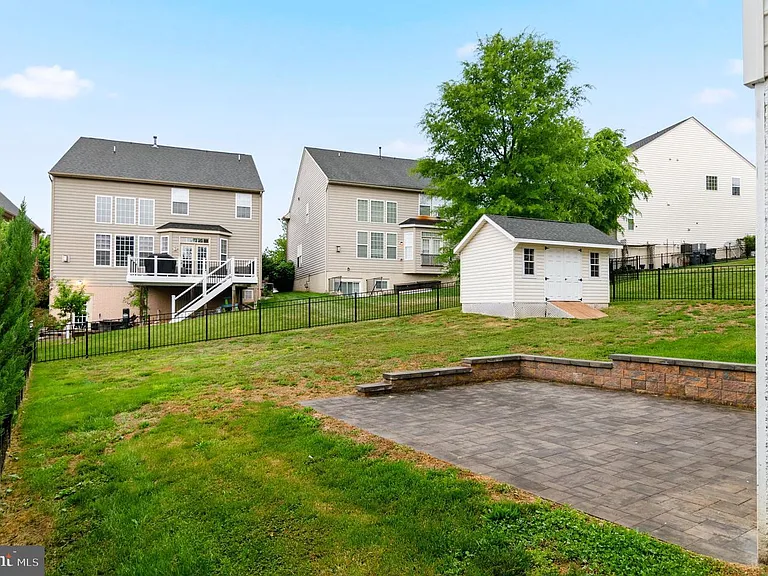 Large yard with patio and shed