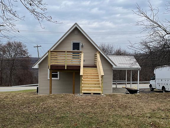 Deck off of the upstairs bedroom leading to the large back yard.