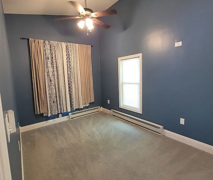 Master bedroom with double ceiling fans