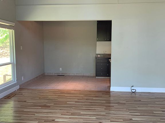 Living room looking into dining area and kitchen