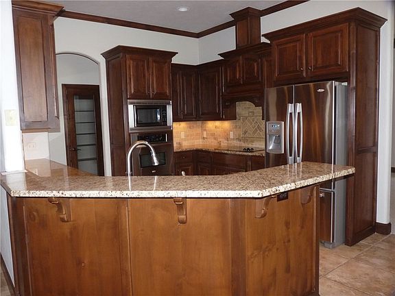 Kitchen has a breakfast bar - beautiful wood!