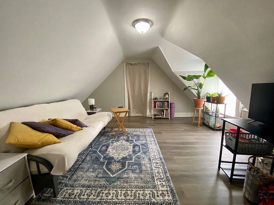 Living room (kitchen is behind curtain)