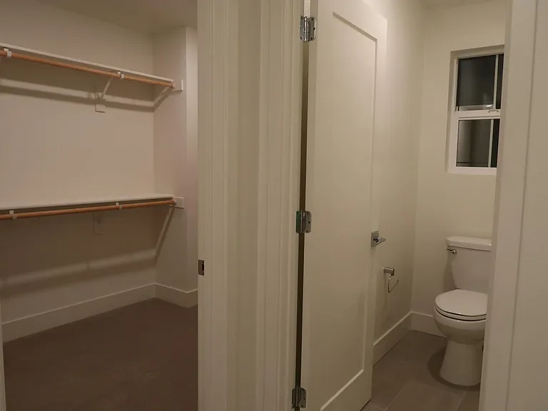Master bathroom walk in closet and toilet